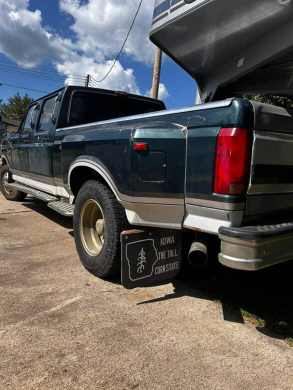 Pickup with retro Iowa Tall Corn State mudflaps mounted