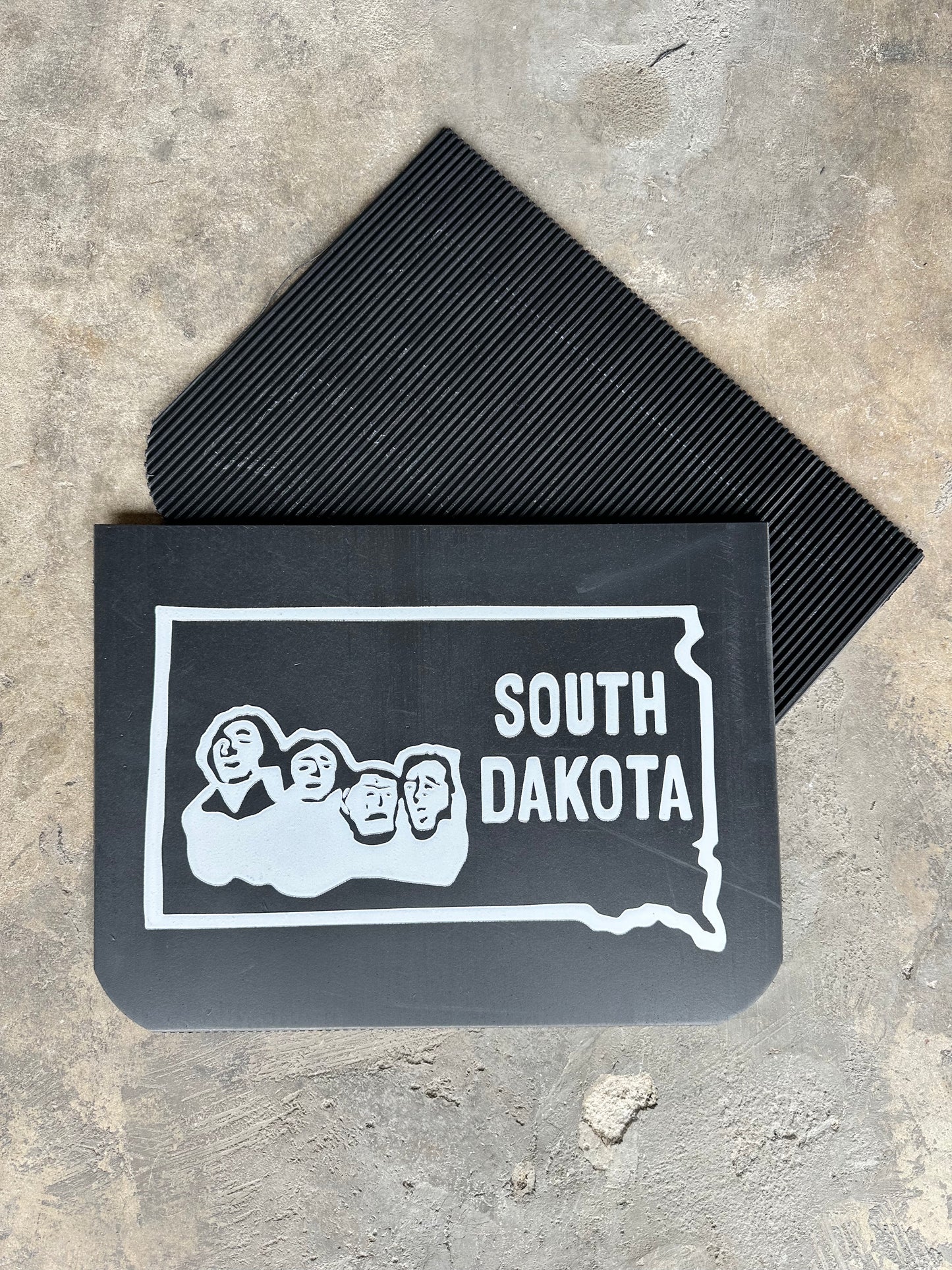 Front and rear view of retro South Dakota state wide mudflaps