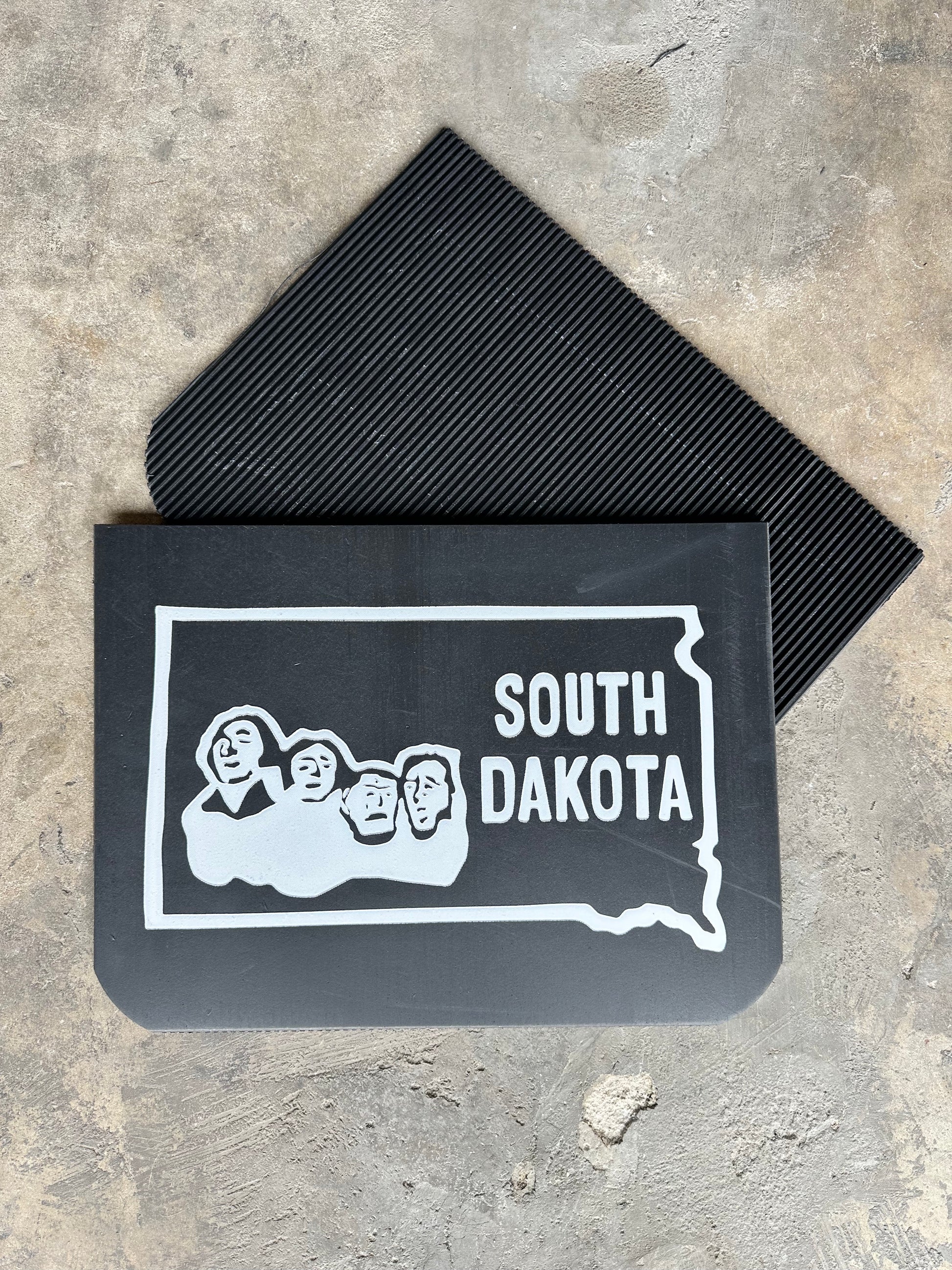 Front and rear view of retro South Dakota state wide mudflaps