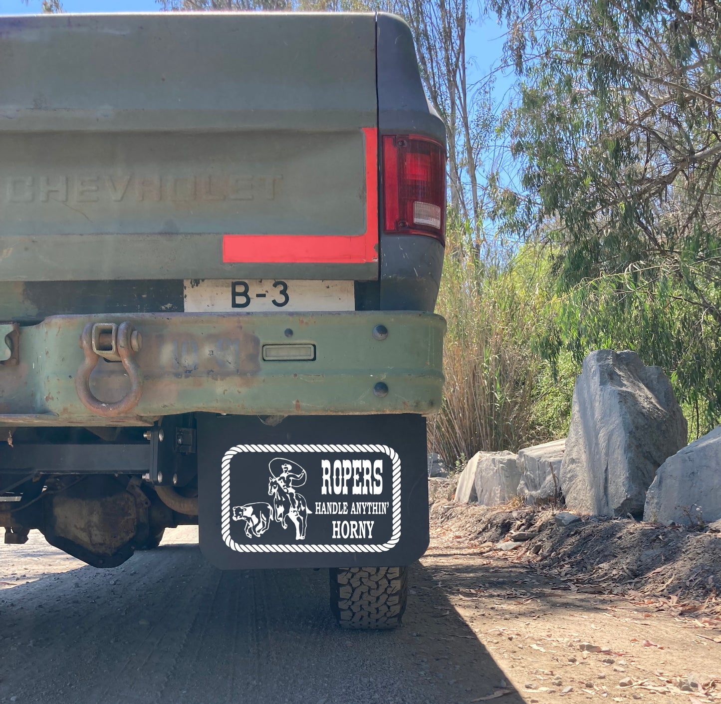 Wide shot of a classic truck fitted with old school ROPER’S HANDLE ANYTHIN’ mudflaps