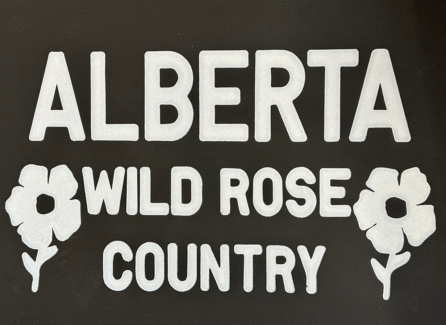 Close up of Alberta Wild Rose Country retro state mudflaps