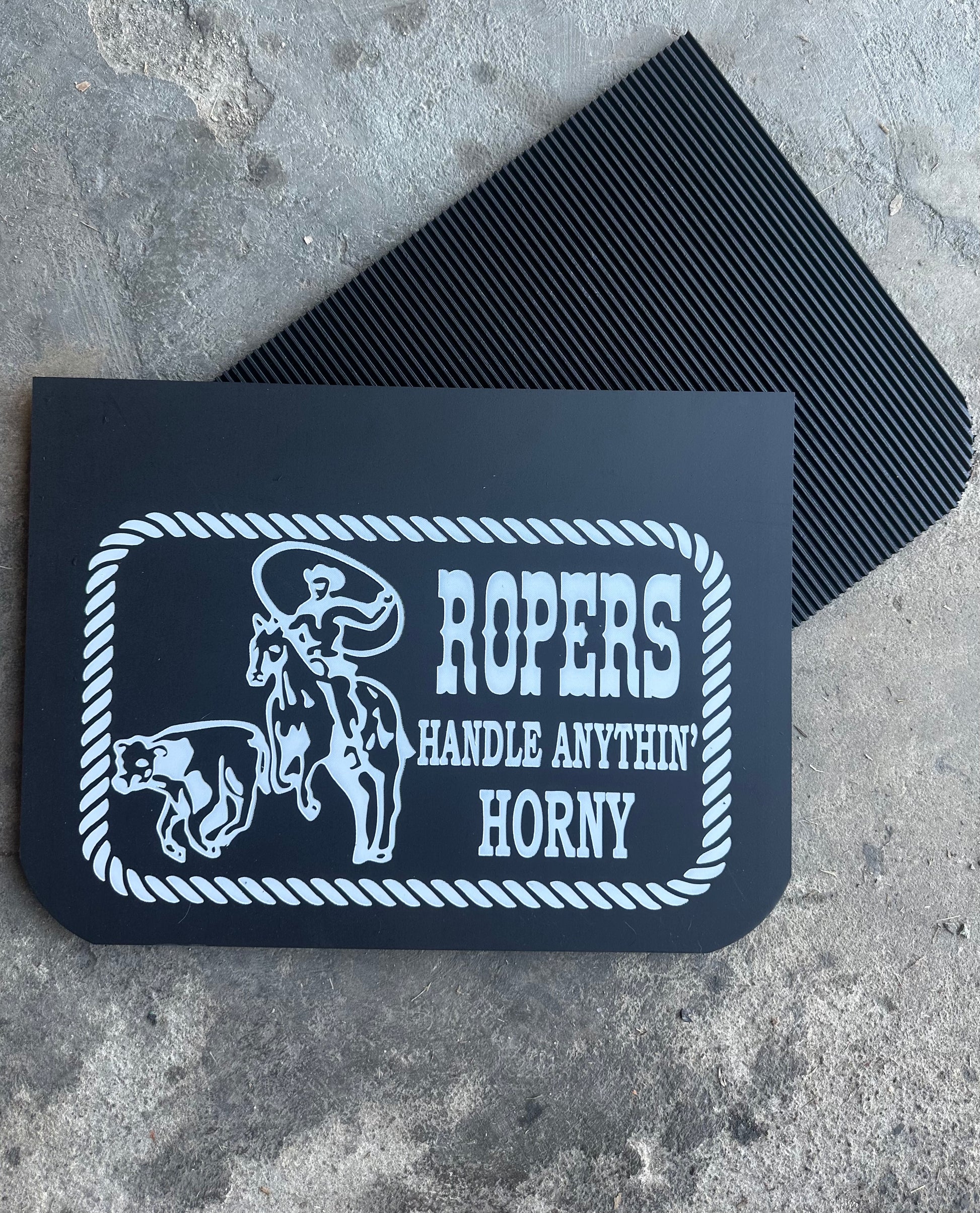 Front and reverse view of hot stamped mudflaps