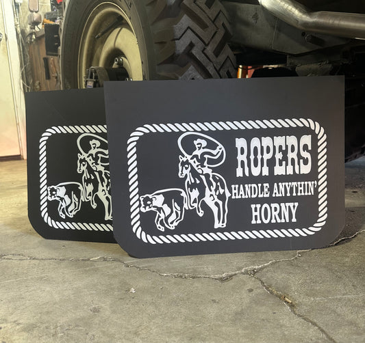 Mudflaps with vintage style text in a garage