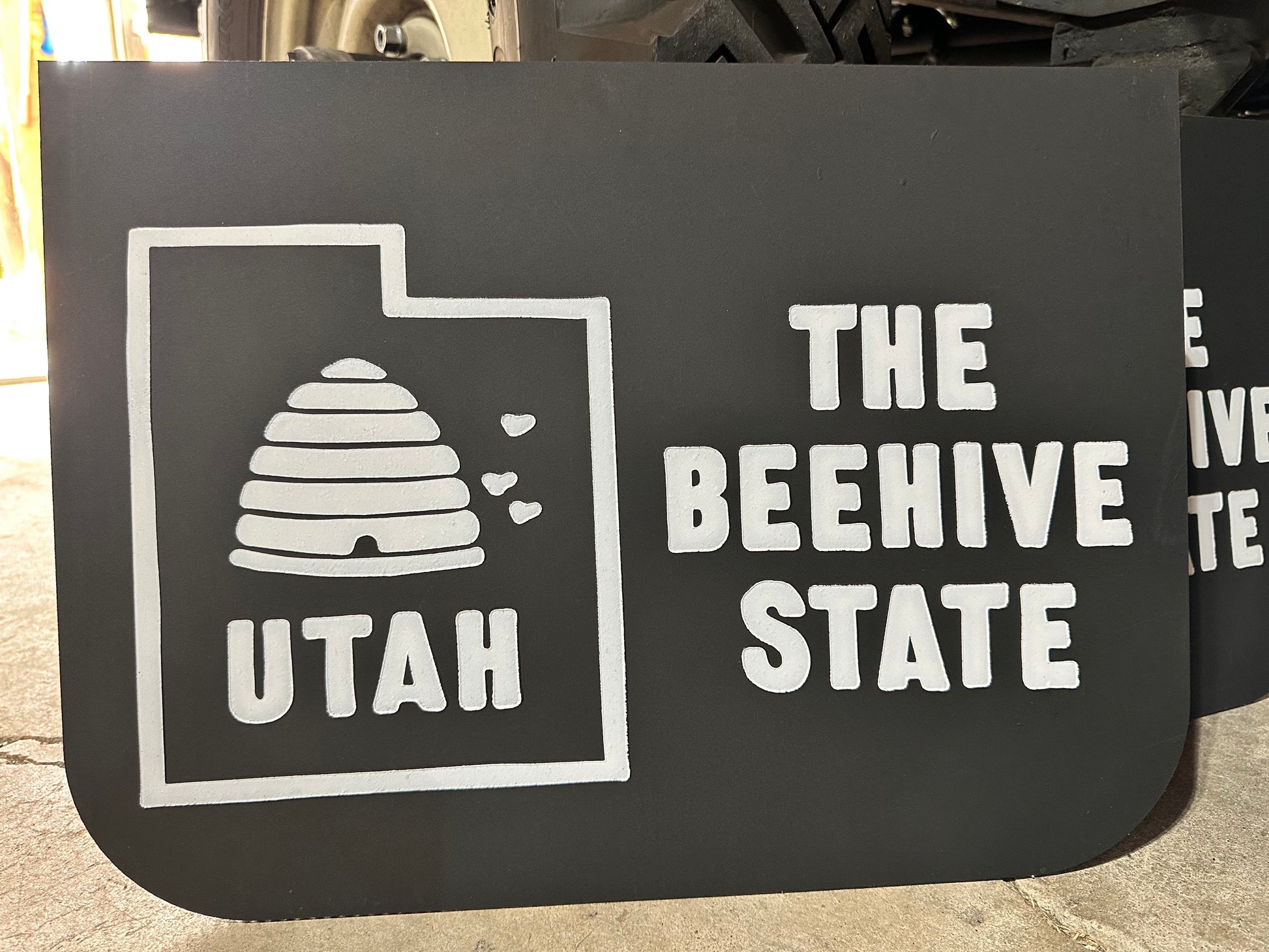 Close up of Utah Beehive State retro wide mudflaps