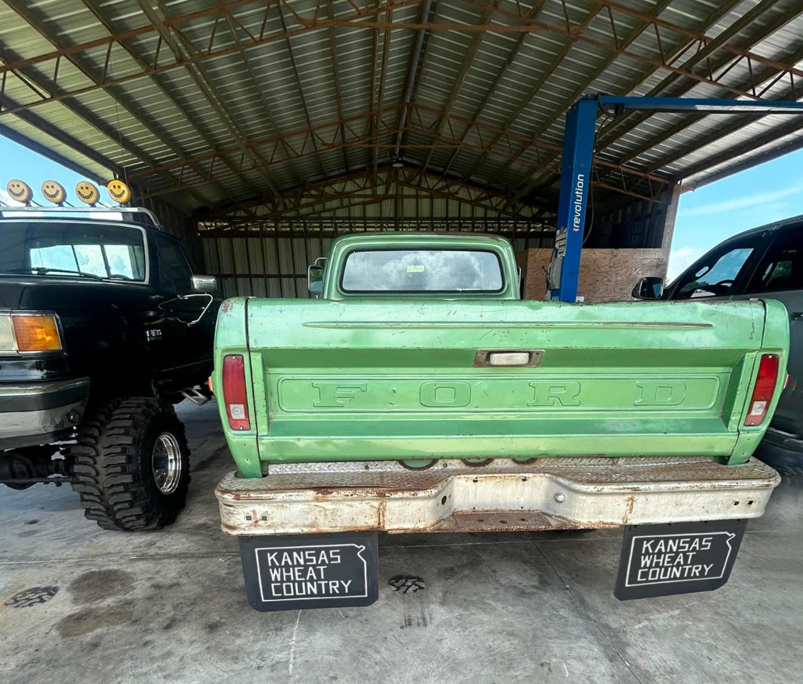 Green Ford truck showing Kansas Wheat Country mudflaps installed